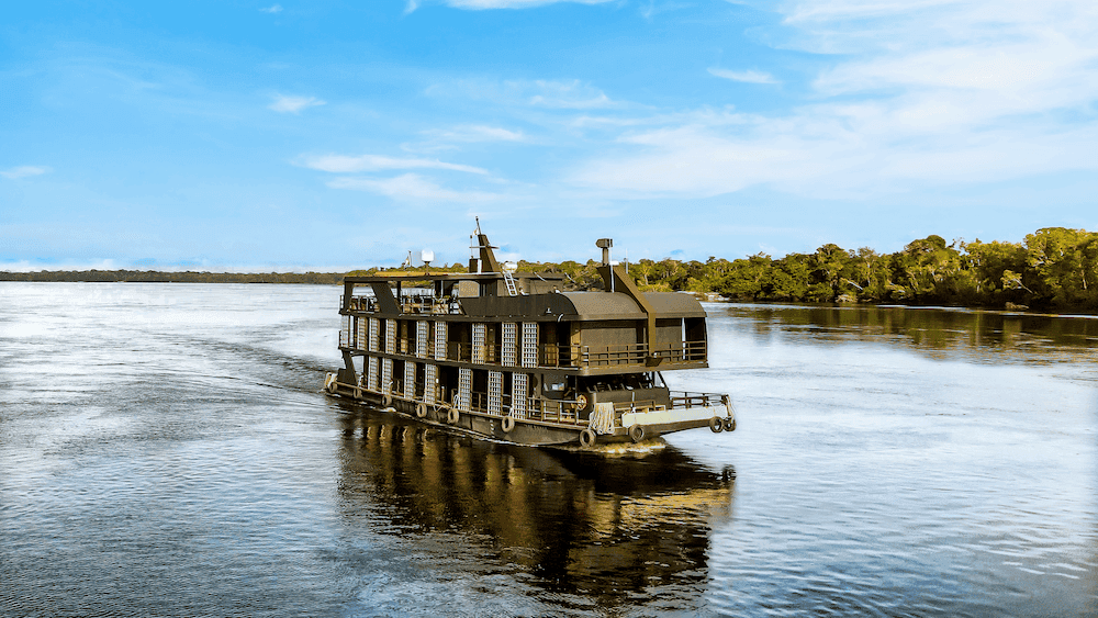 Luxury Zaltana Mothership floating hotel on Amazon River with 5-star accommodations for premium peacock bass fishing expeditions